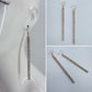 Gold Finish Long Bar Earrings with Clear Rhinestones