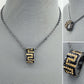 Hematite Chain Necklace with Black and Gold Greek Symbol Pendant