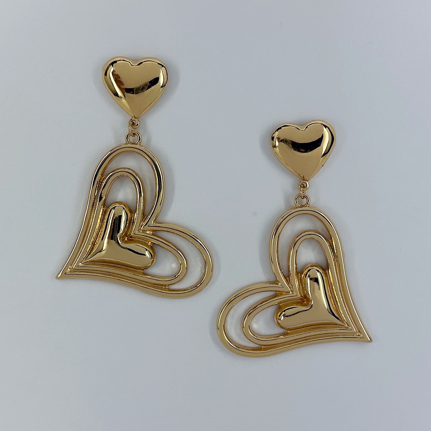 Post Back Earrings With Heart Design And Triple Heart Dangle