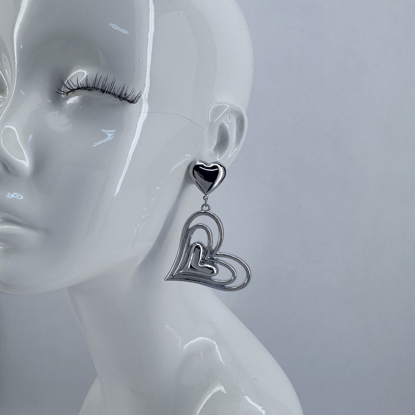 Post Back Earrings With Heart Design And Triple Heart Dangle