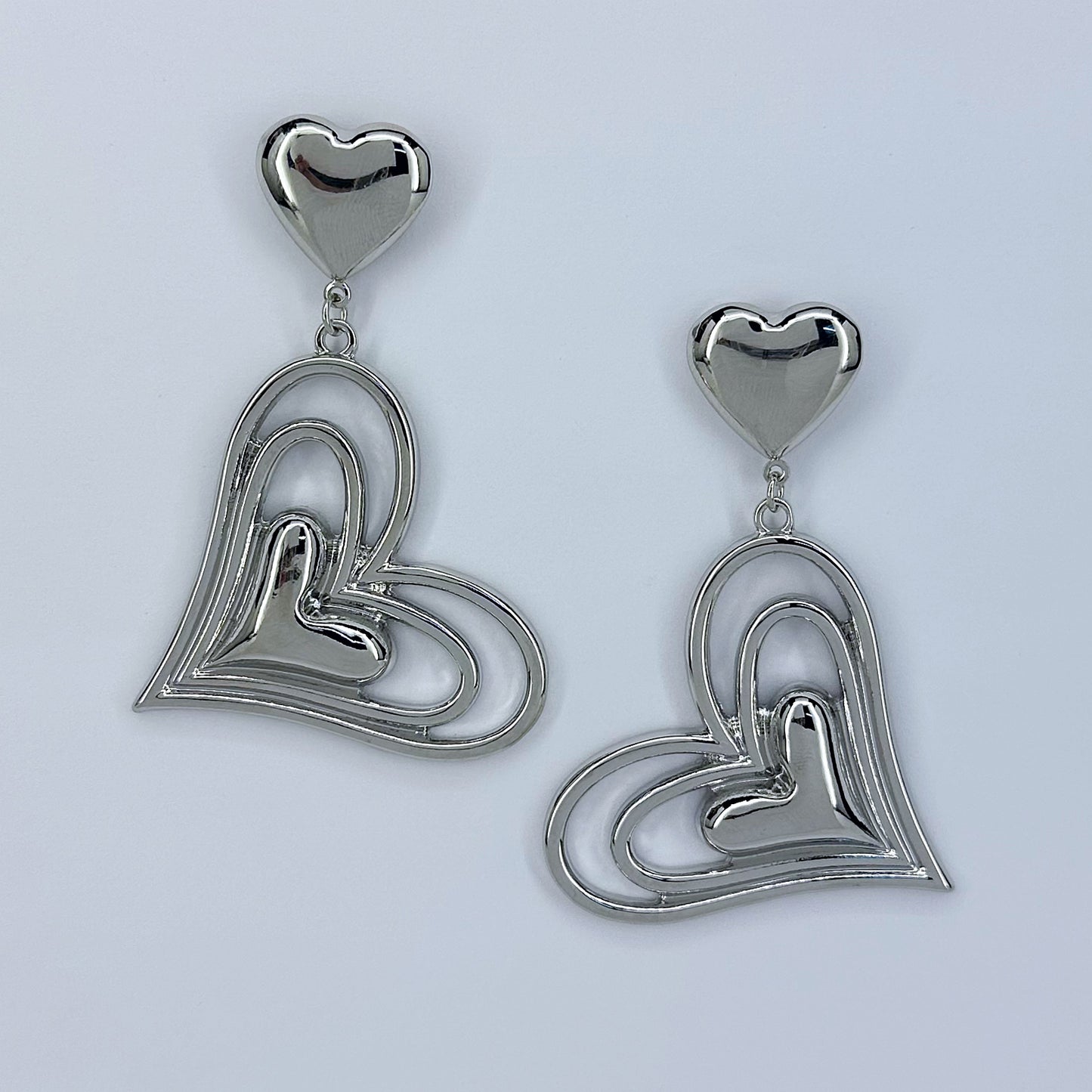 Post Back Earrings With Heart Design And Triple Heart Dangle