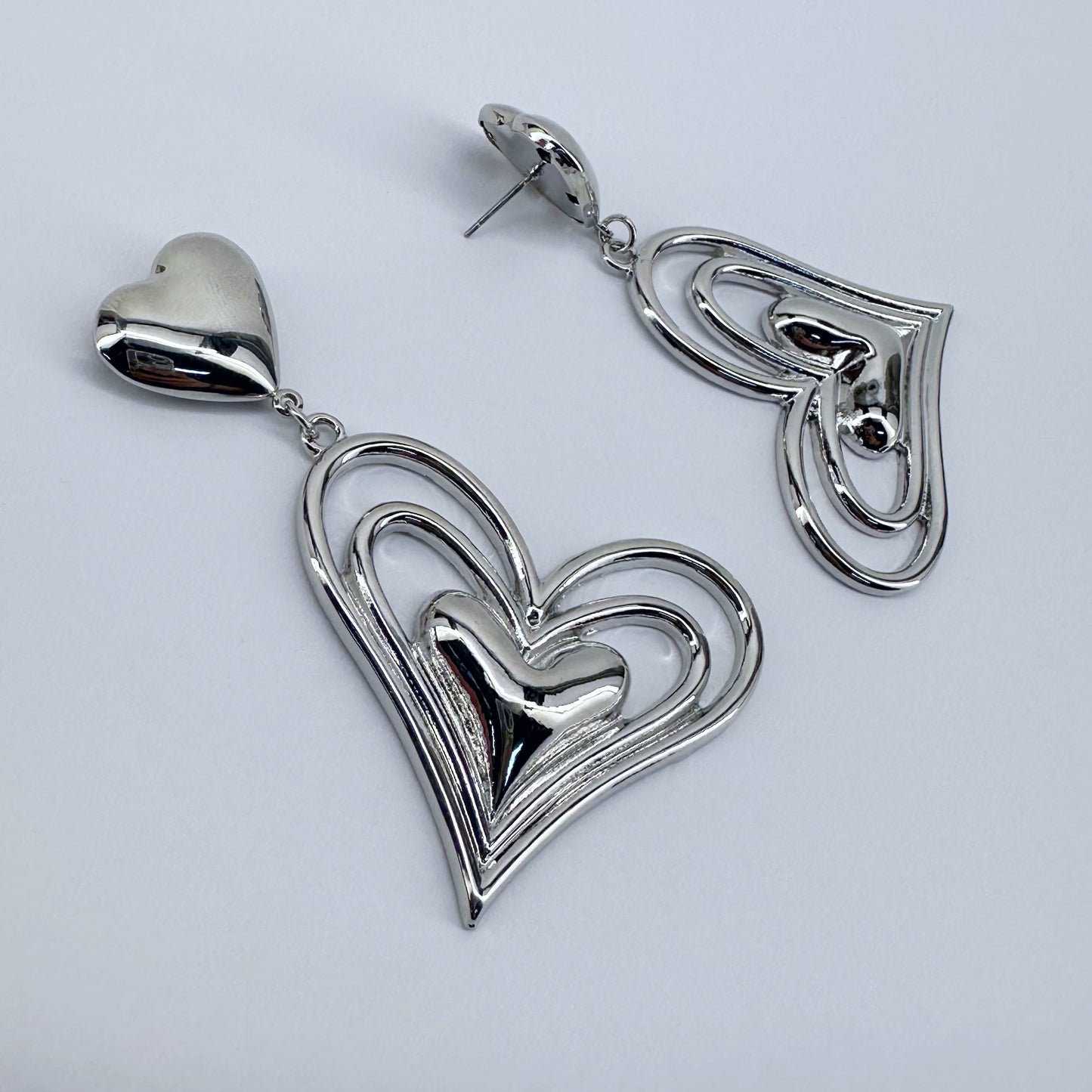 Post Back Earrings With Heart Design And Triple Heart Dangle
