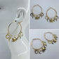 Gold Finish Hoop Earring With Circle, Moon, And Elephant Dangles