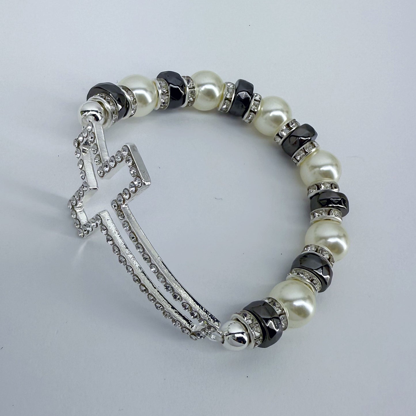 Silver Finish Stretchable Bracelet With Rhinestones Cross And Pearls