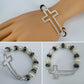 Silver Finish Stretchable Bracelet With Rhinestones Cross And Pearls