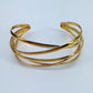 Gold Finish Crossed Metal Cuff Bracelet